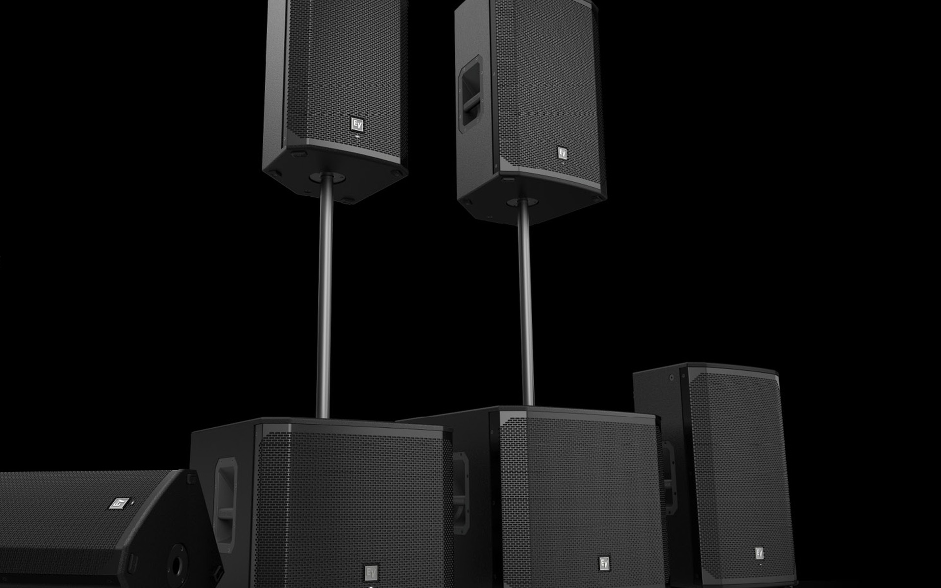 Electro-Voice professional loudspeaker family on stands against a black background
