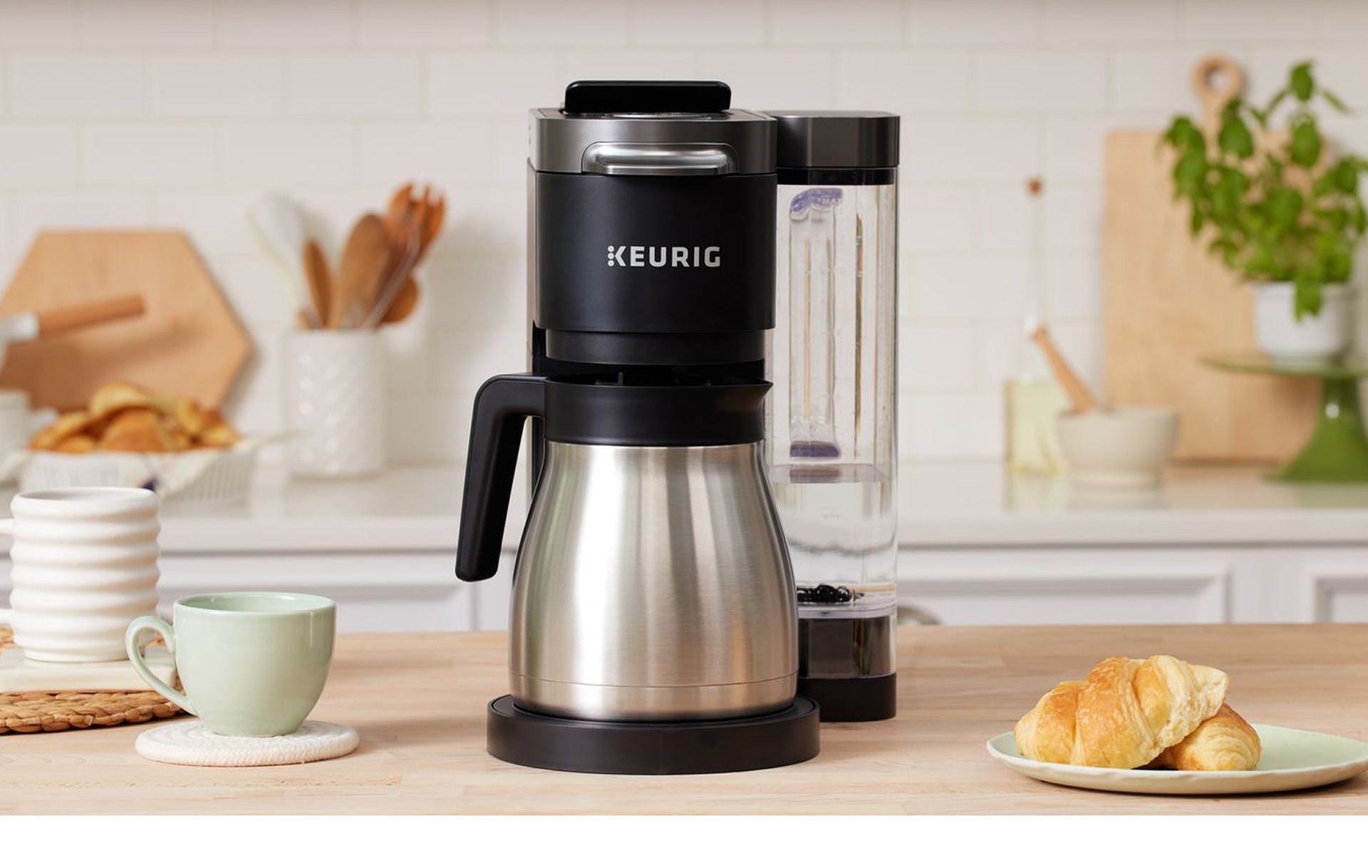 Keurig K-Duo pod and drip coffee combo maker with stainless carafe on a kitchen counter